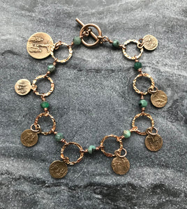 Seven Sorrows Bronze Charm Bracelet - Emerald Gemstones