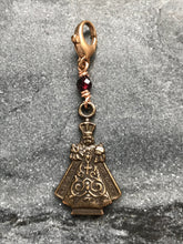 Load image into Gallery viewer, Bag Charm Infant of Prague Zipper Pull - Bronze and Garnet
