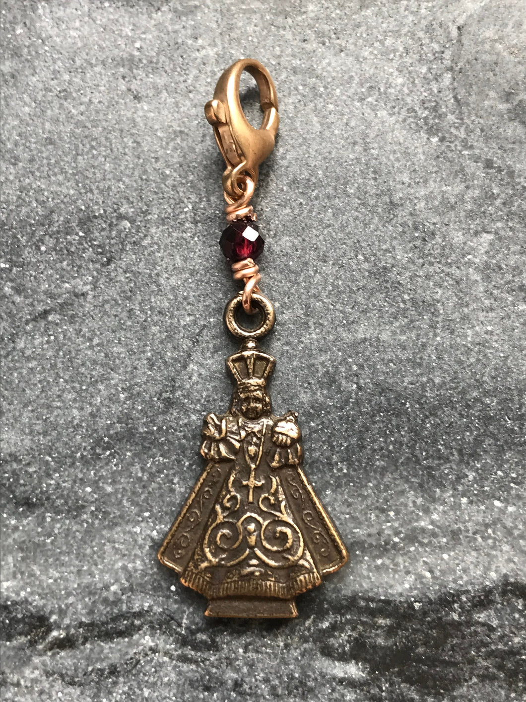 Bag Charm Infant of Prague Zipper Pull - Bronze and Garnet