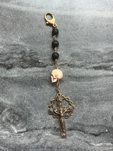 Load image into Gallery viewer, Bag Charm - Memento Mori Zipper Pull - Bronze and Lava Bead - Three Hail Nary Chaplet
